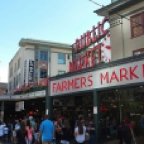 Neon "Public Market" sign over entrance to Pike Place Market in Seattle, Wash.
