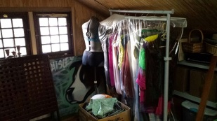 Dressmaker form and old clothes in attic