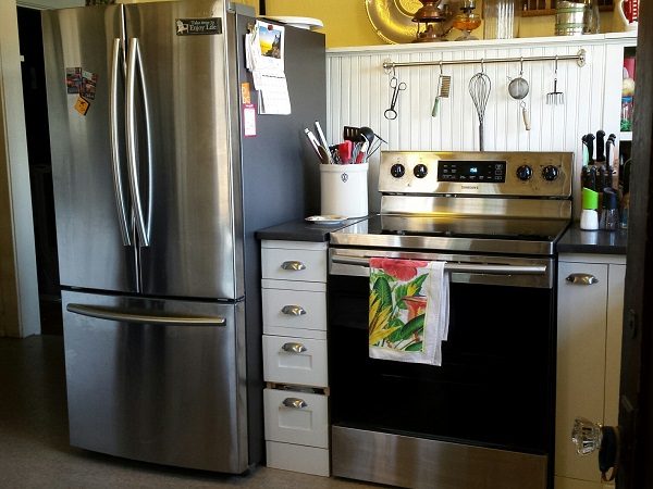 SamSung French door fridge and electric stove.